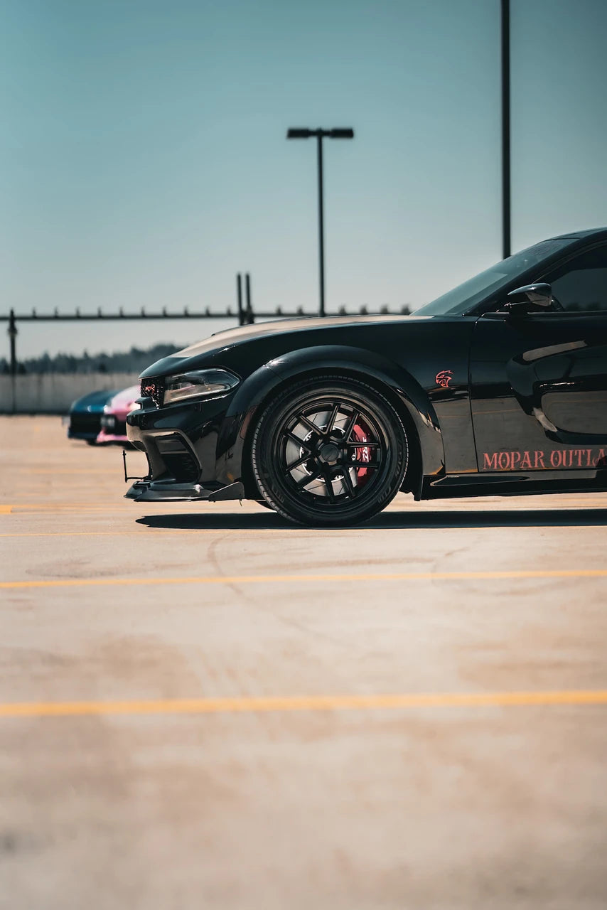 Black Dodge Charger Widebody parked, side view