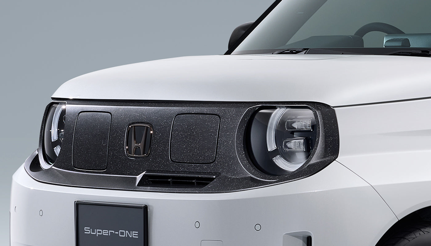 Honda Access black chrome emblem detail on the Honda Super-ONE
