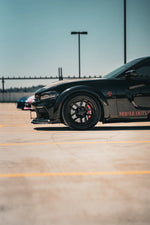 Black Dodge Charger Widebody parked, side view - Paragon Thumbnail