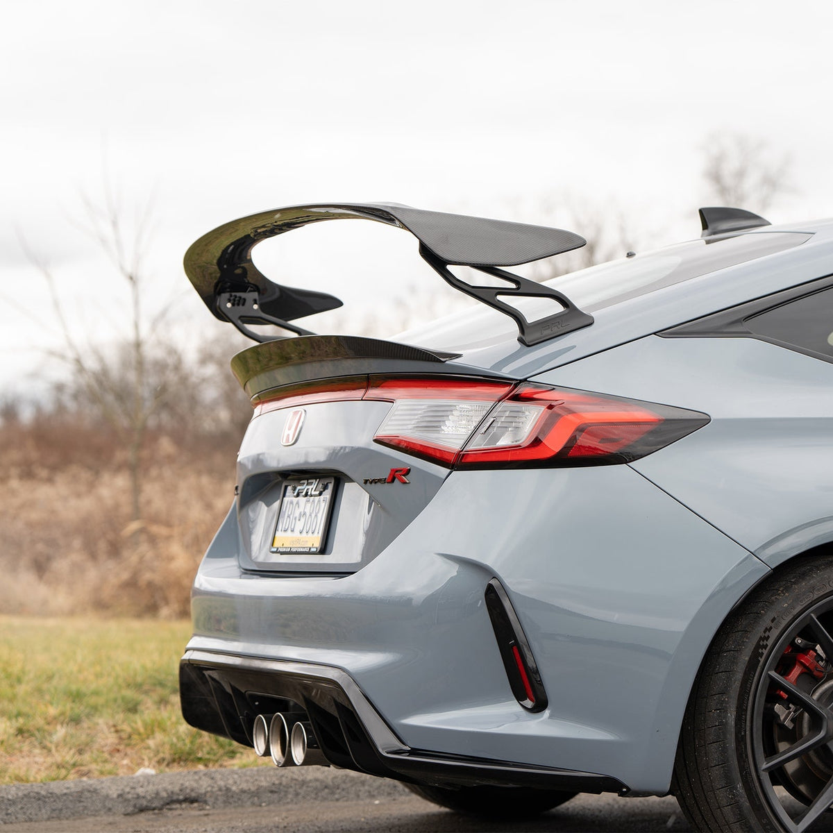 PRL wing risers fitted to a grey Civic Type R FL5 - rear three-quarter view