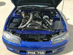 Turbocharged SR20DET in a blue Nissan 200SX S15 engine bay - Nitto Thumbnail