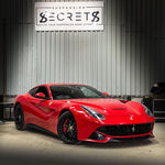 Red Ferrari F12 parked in the Suspension Secrets workshop - Suspension Secrets Thumbnail