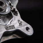 Suspension Secrets camber plate, close-up of the engraved logo and machined billet aluminium edge - Suspension Secrets Thumbnail