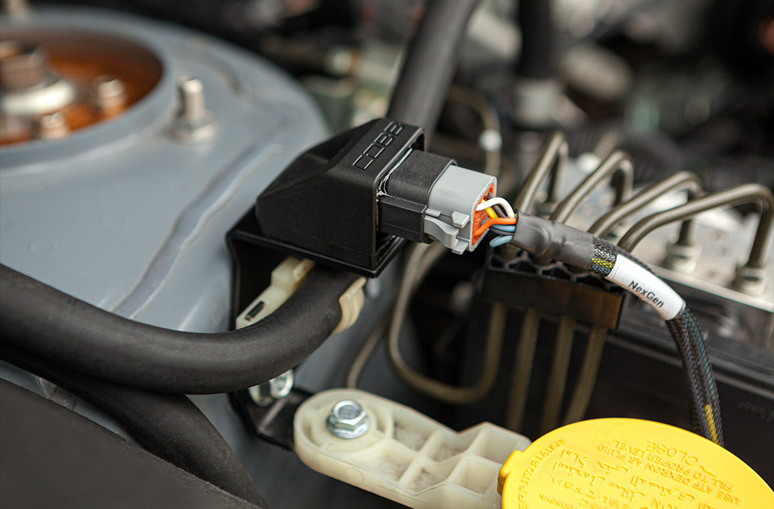 COBB NexGen flex fuel module – strut tower mounting close-up (product illustration)