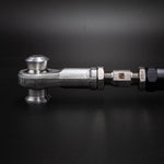 Suspension Secrets rear link arm, side view of the rod end and adjuster on a dark background - Suspension Secrets Thumbnail