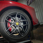 Ferrari F12 front wheel with a string alignment line in place - Suspension Secrets Thumbnail