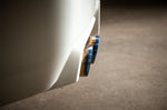 COBB titanium cat-back exhaust – Subaru WRX STI sedan – tips beside a white rear bumper - Cobb Tuning Thumbnail
