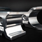 Suspension Secrets front camber blocks, close-up of the machined channels on black - Suspension Secrets Thumbnail