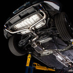 COBB titanium cat-back exhaust – Volkswagen Golf GTI Mk7.5 – installed, underside view on hoist - Cobb Tuning Thumbnail