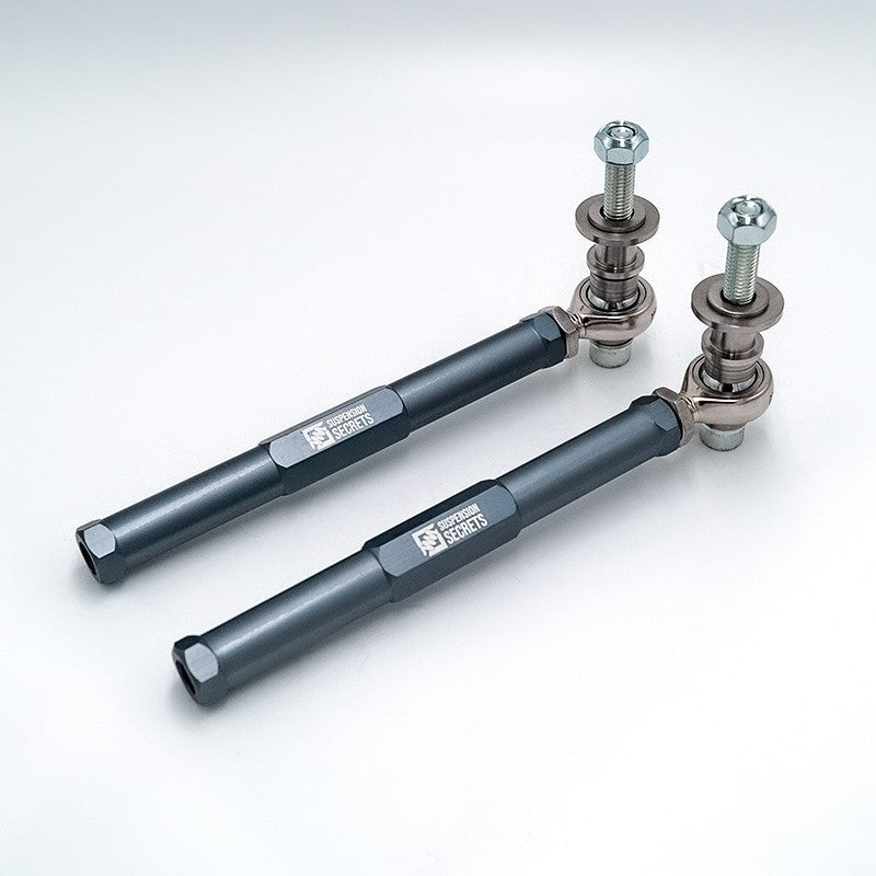 Suspension Secrets bump steer tie rod ends, grey pair with rod ends and studs, white background - Suspension Secrets