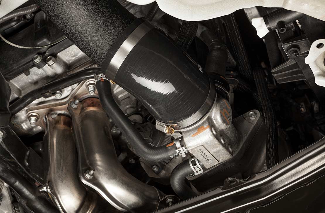 COBB intake tube – black silicone coupler and clamp at the turbo end (product illustration)