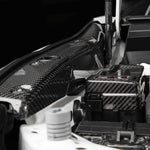 COBB Redline carbon fender shrouds – Subaru WRX VB – installed, close view near fuse box - Cobb Tuning Thumbnail