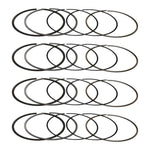 Four Manley piston ring sets laid out, one set per cylinder (product illustration) - Manley Thumbnail