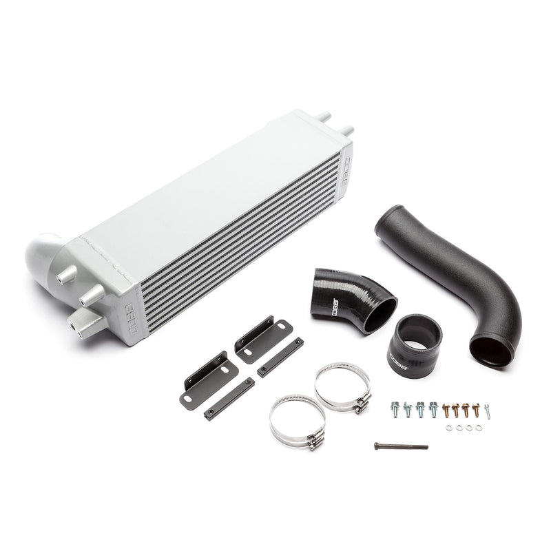 COBB front mount intercooler – Ford Mustang EcoBoost – core, pipe, couplers and hardware laid out - Cobb Tuning