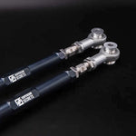 Suspension Secrets rear toe arms on a dark background, close-up of the rod ends and engraved logos - Suspension Secrets Thumbnail