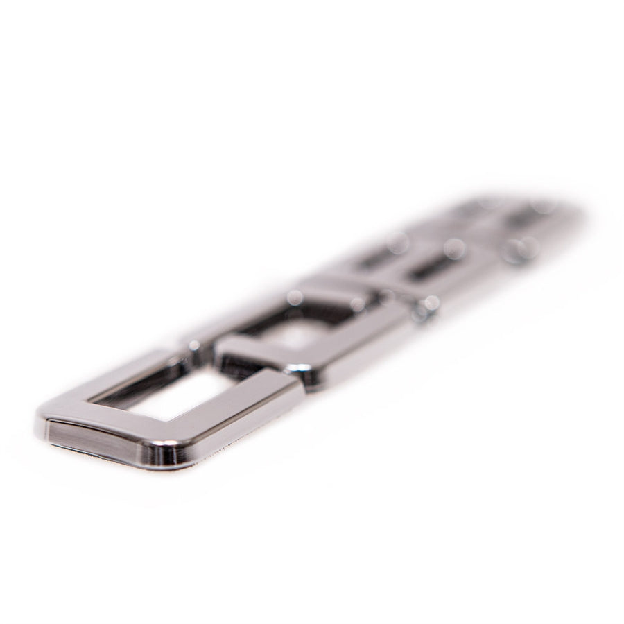 COBB vehicle badge – chrome letters angled close-up