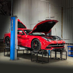Red Ferrari F12 on a workshop hoist during a string alignment - Suspension Secrets Thumbnail