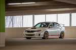 COBB Titan7 T-S5 wheel – Subaru Impreza WRX STI sedan – Cyber Gold wheels on a white STI in a car park - Cobb Tuning Thumbnail