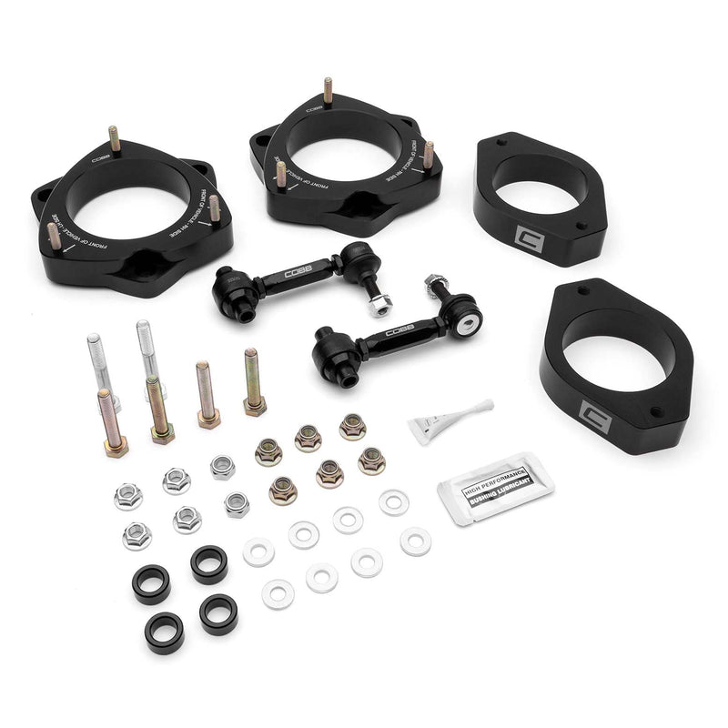 COBB lift kit – Subaru WRX/STI VA – front and rear spacers, sway bar links and hardware laid out - Cobb Tuning