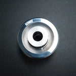 Suspension Secrets monoball bush, top view of the flange and sleeve on a dark background - Suspension Secrets Thumbnail