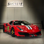Red Ferrari 488 Pista with white stripes in the Suspension Secrets workshop - Suspension Secrets Thumbnail