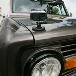 Scosche MagicMount action mount kit – camera on magnetic base on a bonnet (product illustration) - Cobb Tuning Thumbnail
