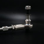 Suspension Secrets rear camber arm, close-up of the rod end, stud and spacer on a dark background - Suspension Secrets Thumbnail