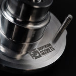 Suspension Secrets rear top mount on black, close-up of the logo, housing and stud - Suspension Secrets Thumbnail