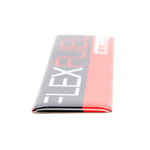 COBB Flex Fuel badge – domed edge and thickness, angled close-up - Cobb Tuning Thumbnail
