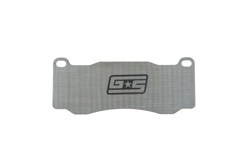 GrimmSpeed titanium front brake shim for the WRX STI (VA) - front face with GS logo - GrimmSpeed