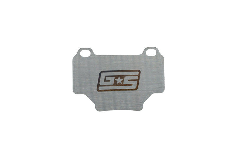 GrimmSpeed titanium rear brake shim for the WRX STI (VA) - front face with GS logo - GrimmSpeed