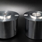 Suspension Secrets solid rear subframe bushes, pair side by side on a dark background - Suspension Secrets Thumbnail