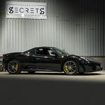 Black Ferrari F430 Spider, side view in the Suspension Secrets workshop - Suspension Secrets Thumbnail