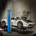 White Ferrari F8 on a workshop hoist with string alignment lines set up - Suspension Secrets Thumbnail