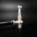 Suspension Secrets bump steer tie rod end, rod end with stud and shim spacer stack on black - Suspension Secrets Thumbnail