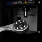 Suspension Secrets front control arm bush pressed into a control arm, workshop press behind - Suspension Secrets Thumbnail