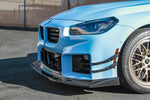 APR carbon air dam lip on a BMW M2 G87, low front corner view - APR Performance Thumbnail