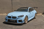 Front view of a light blue BMW M2 G87 fitted with the APR carbon front lip - APR Performance Thumbnail