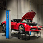 Red Ferrari 488 on a workshop hoist during a string alignment - Suspension Secrets Thumbnail