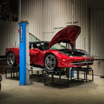 Red Ferrari 458 on a workshop hoist with alignment strings fitted - Suspension Secrets Thumbnail