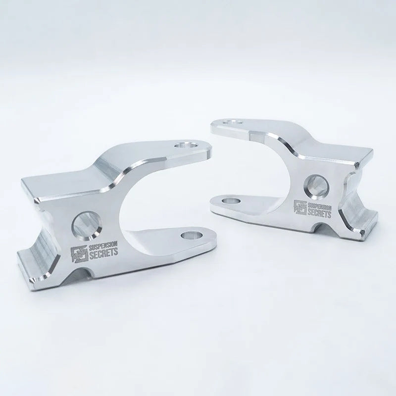 Suspension Secrets front camber blocks, left and right pair on a white background - Suspension Secrets
