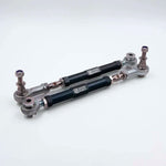 Suspension Secrets adjustable rear toe arms, pair with black bodies on a light grey background - Suspension Secrets Thumbnail