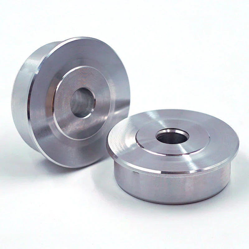 Suspension Secrets rear solid bush inserts, two billet aluminium inserts on white - Suspension Secrets