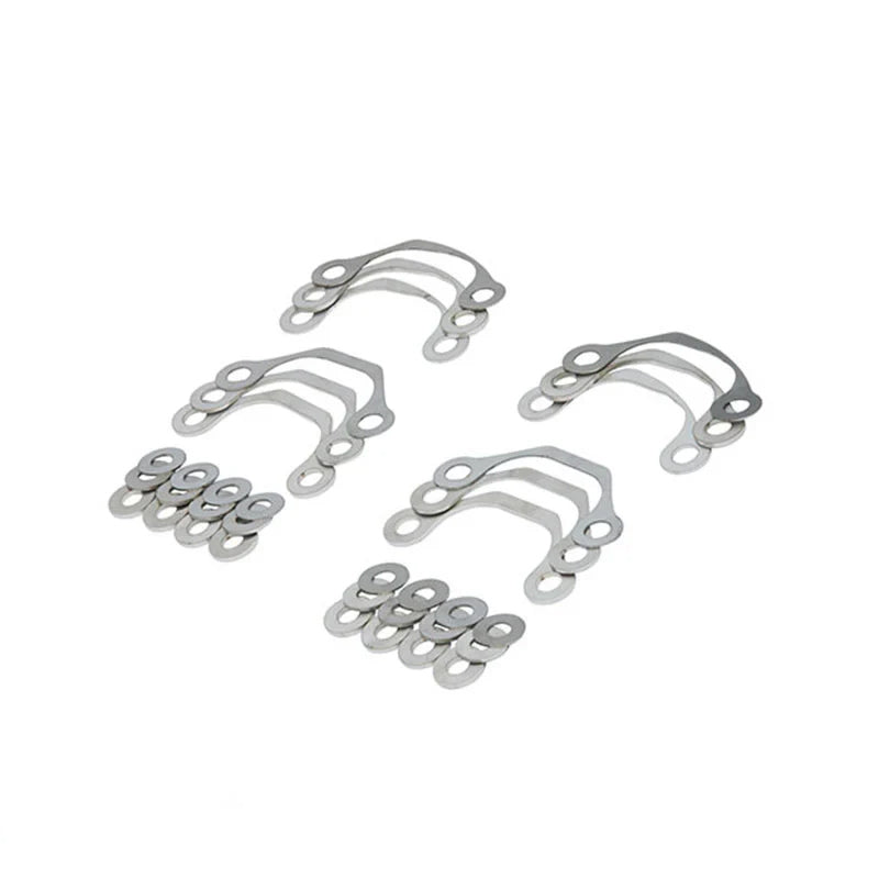 Suspension Secrets camber shim kit, curved shims and washers laid out in four groups - Suspension Secrets