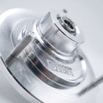 Suspension Secrets front top mount, close-up of the bearing housing, stud and engraved logo - Suspension Secrets Thumbnail
