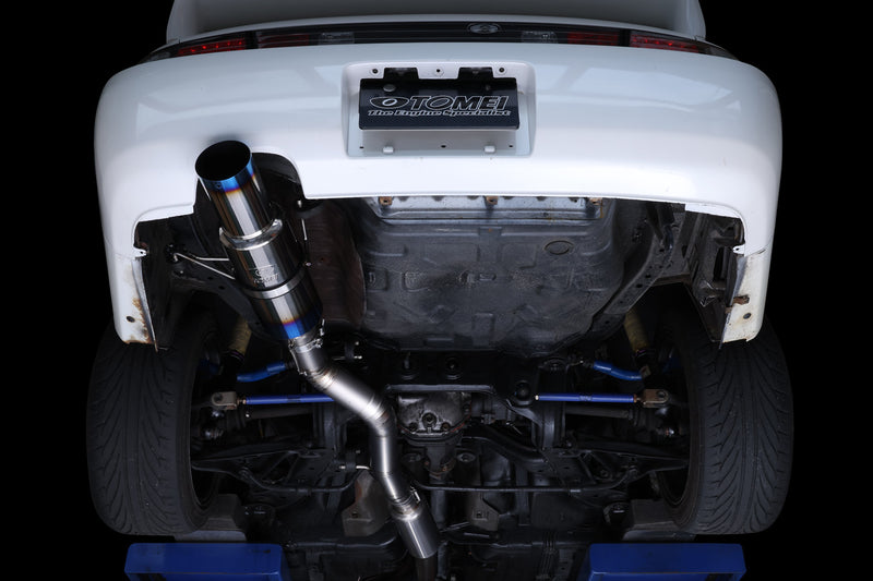 Tomei Ti RACING titanium muffler fitted under a Nissan Silvia S14, viewed from below - Tomei
