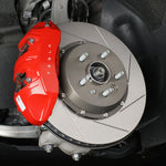Paragon front rotor fitted behind red Tesla caliper - Paragon Thumbnail