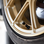 COBB aluminium valve stem caps – fitted to a gold wheel valve (product illustration) - Cobb Tuning Thumbnail