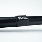 Suspension Secrets bump steer tie rod end, close-up of the logo on the black body - Suspension Secrets Thumbnail