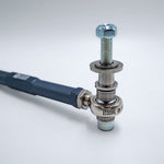 Suspension Secrets grey tie rod end, rod end, spacers and stud on a white background - Suspension Secrets Thumbnail